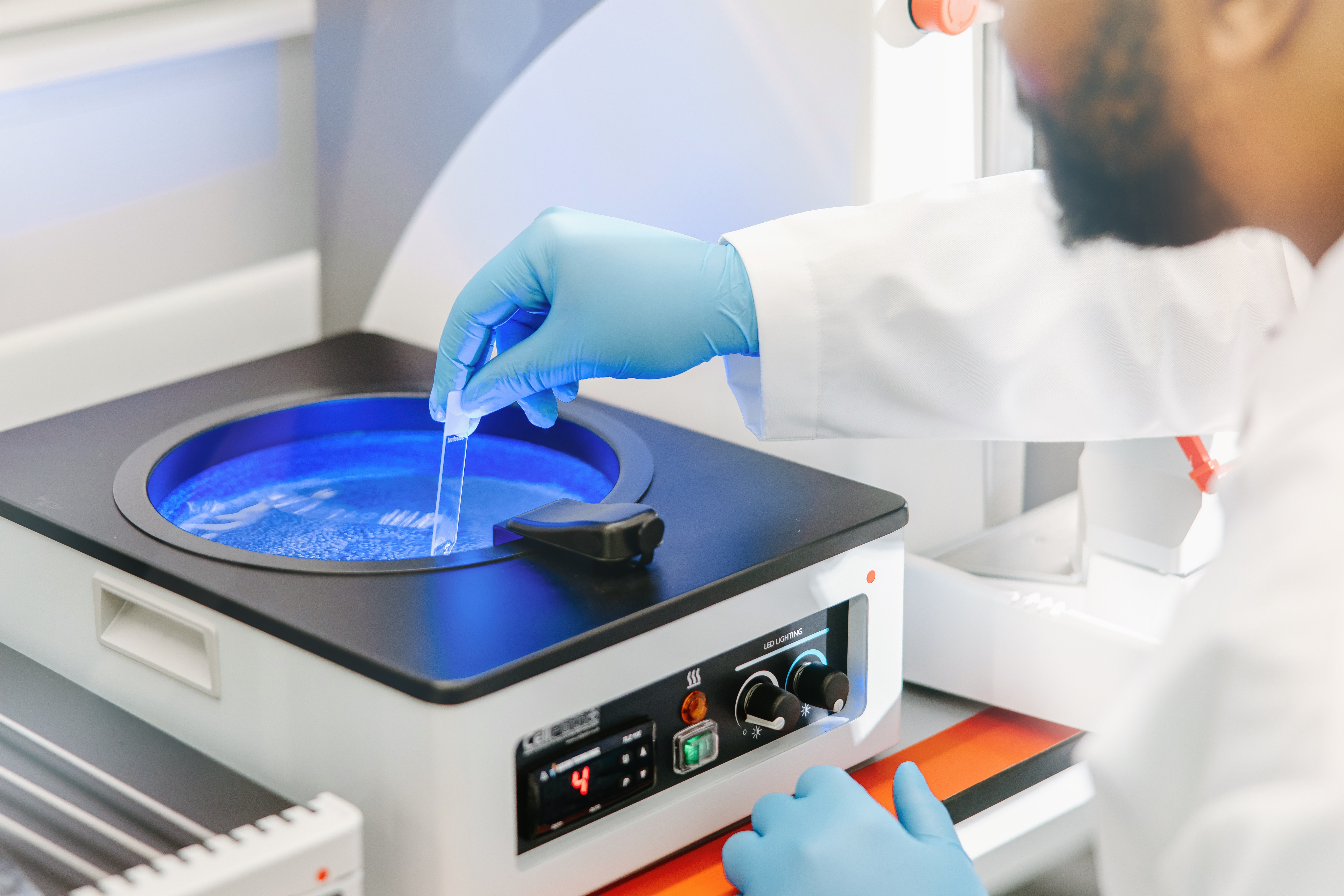 Specialist handling a sample during cord blood banking processing